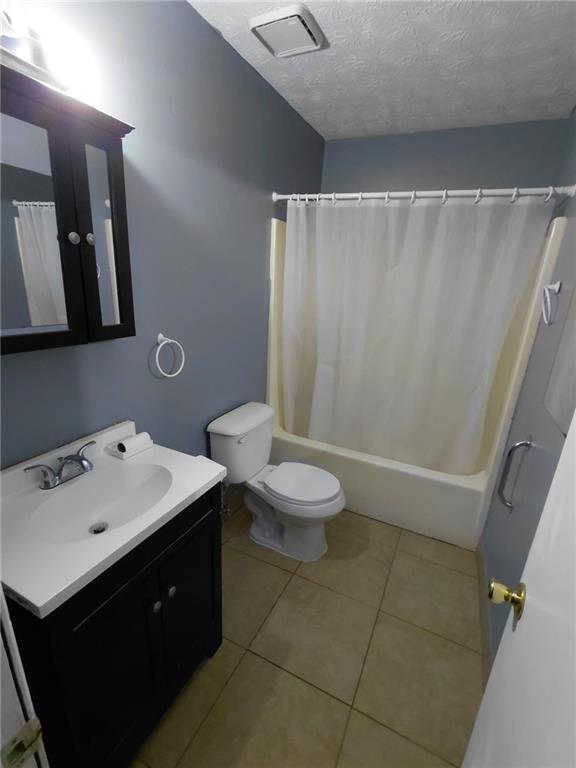 1608 Enchanted Forest Drive Conley, GA 30288 - Photo 21 of 22 a bathroom with a sink a toilet and shower