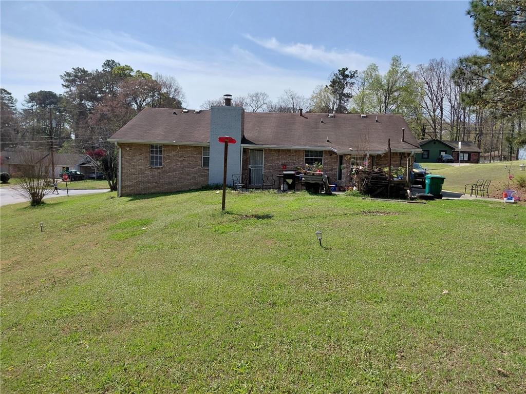 1608 Enchanted Forest Drive Conley, GA 30288 - Photo 4 of 22 a view of a house with a yard and sitting area