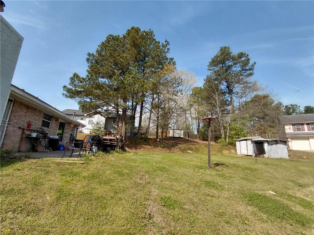 1608 Enchanted Forest Drive Conley, GA 30288 - Photo 8 of 22 a view of a yard with a house and a park