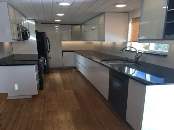 a kitchen with a table chairs and a stove
