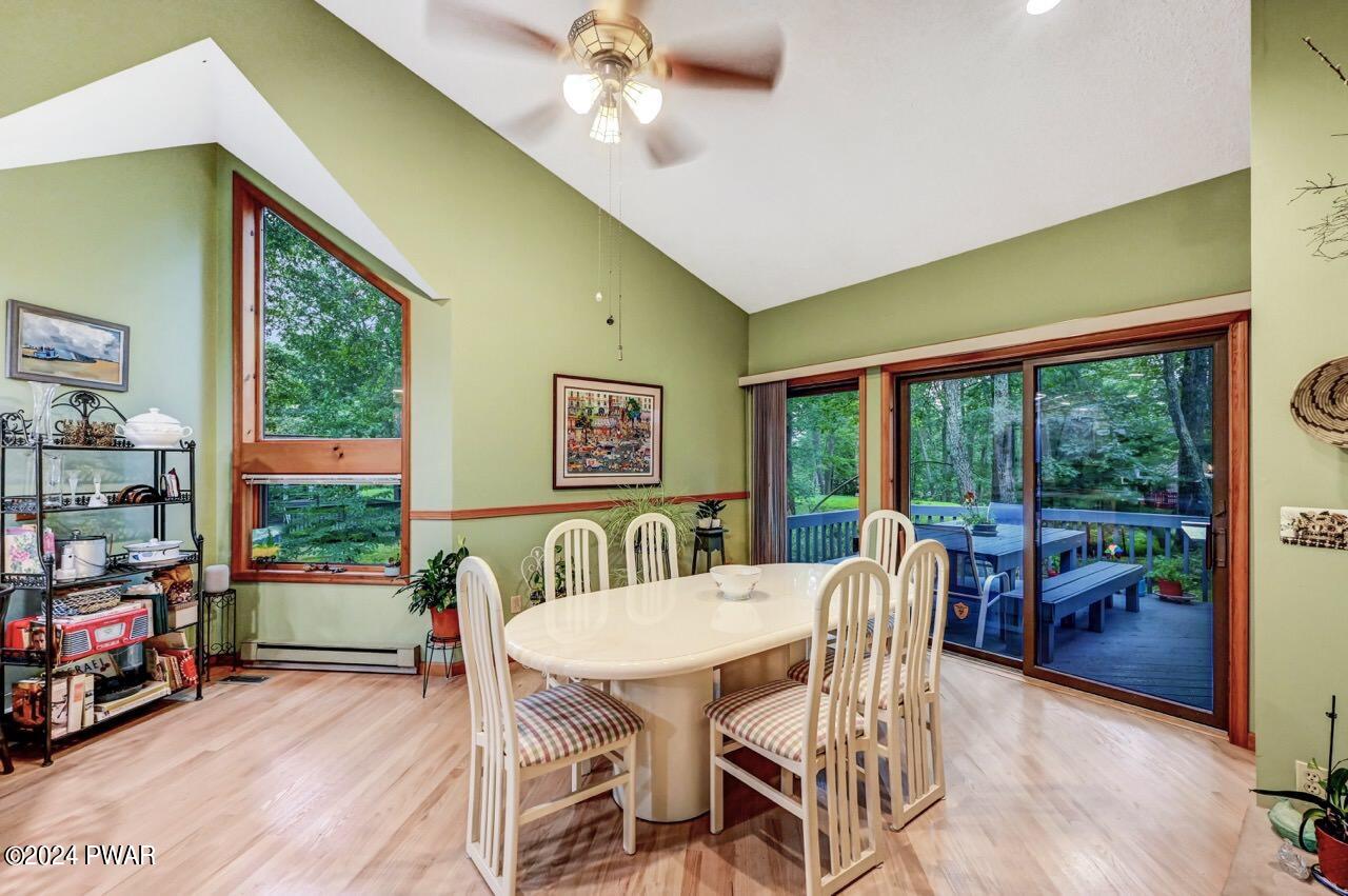 141 Maple Ridge Drive Hawley, PA 18428 - Photo 36 of 84 a view of a dining room with furniture window and outside view