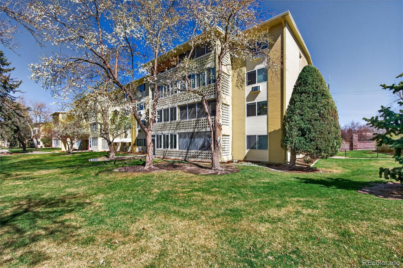720 South Clinton Street, Unit B1 Denver, CO 80247 - Photo 18 of 19 front view of a building with a yard