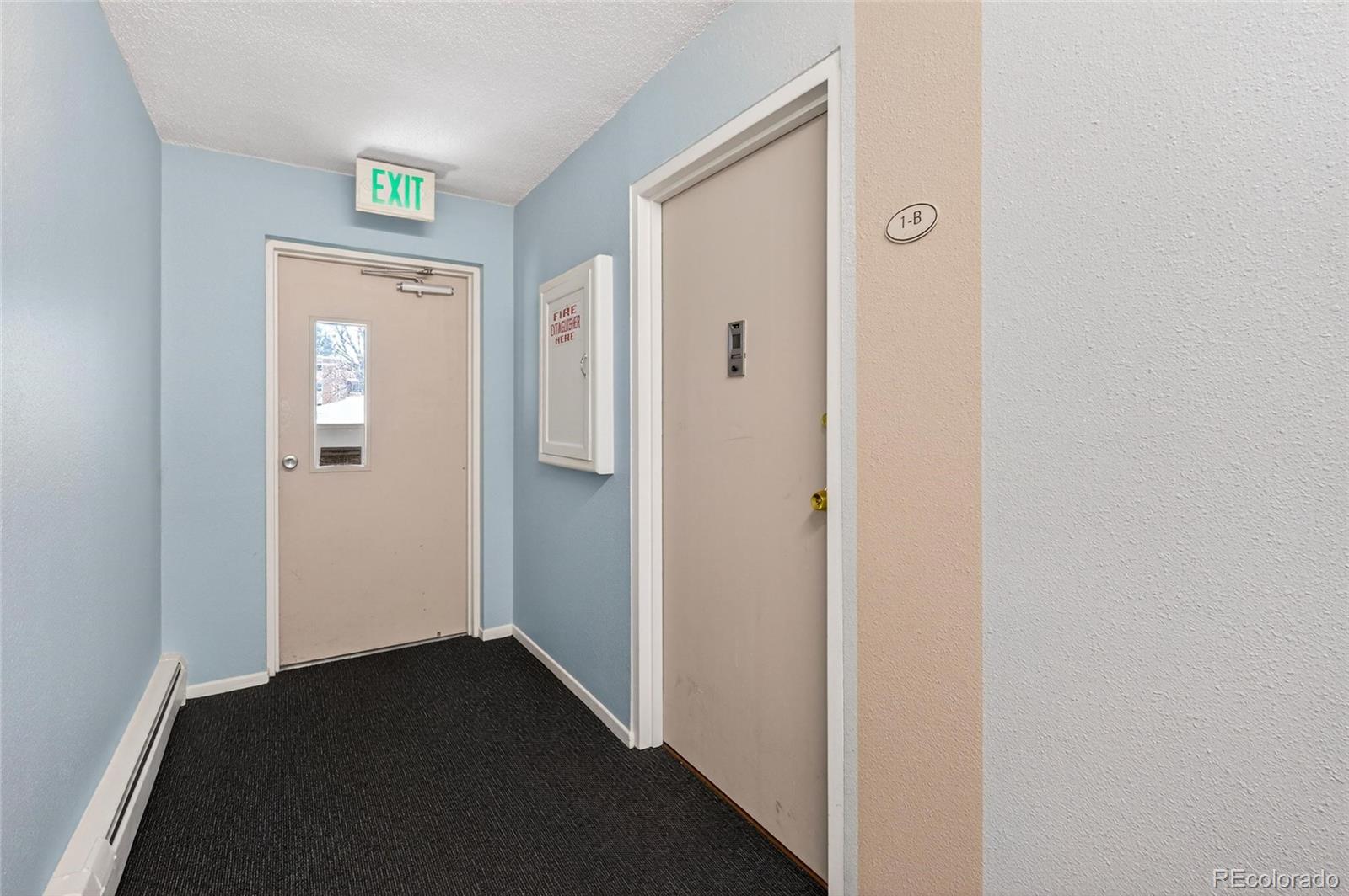 720 South Clinton Street, Unit B1 Denver, CO 80247 - Photo 2 of 19 a view of a hallway with wooden floor and a hallway