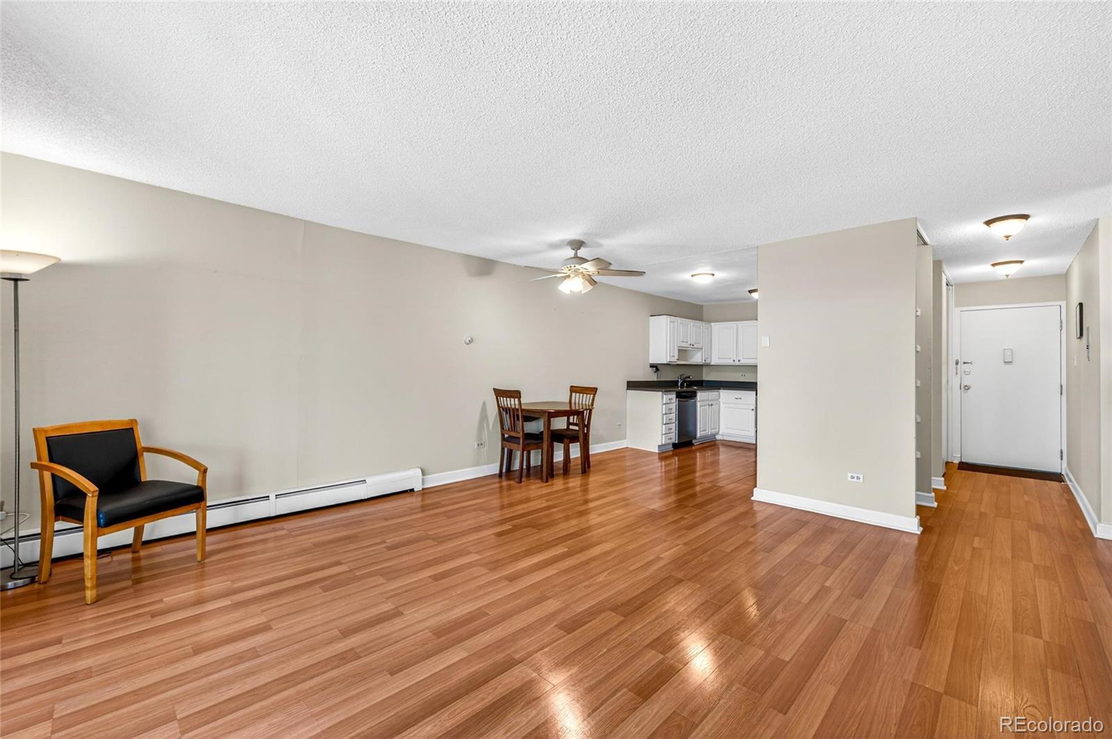 720 South Clinton Street, Unit B1 Denver, CO 80247 - Photo 6 of 19 a view of a livingroom with furniture and wooden floor