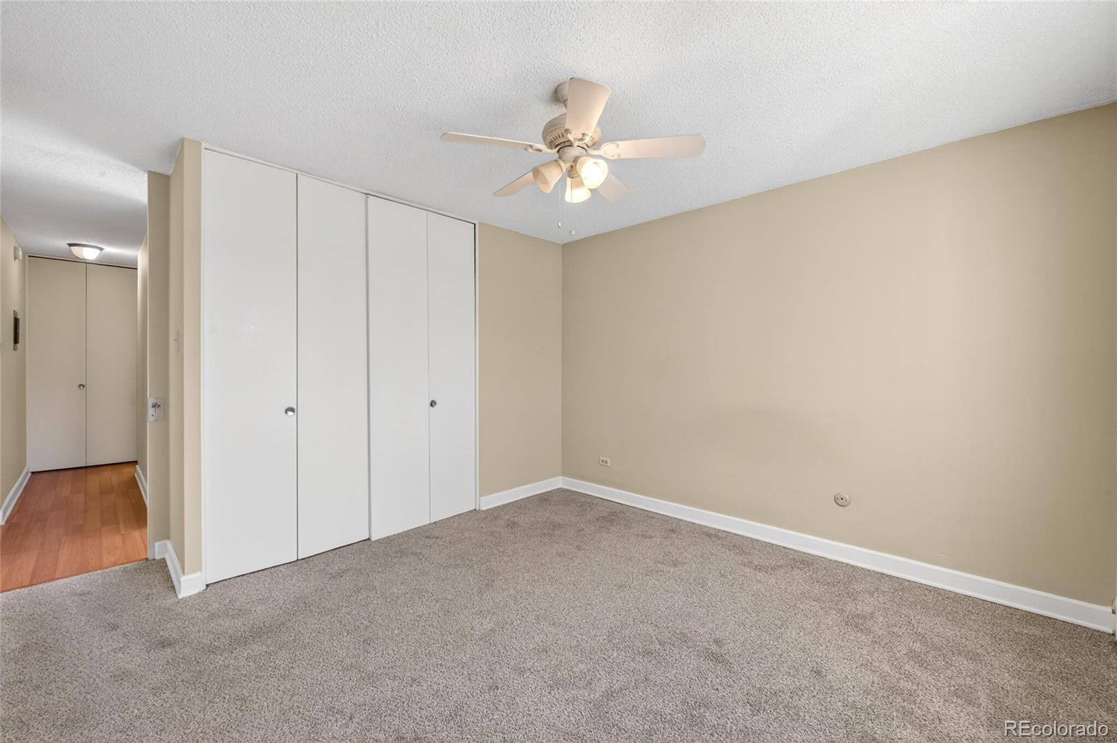720 South Clinton Street, Unit B1 Denver, CO 80247 - Photo 10 of 19 wooden floor in an empty room