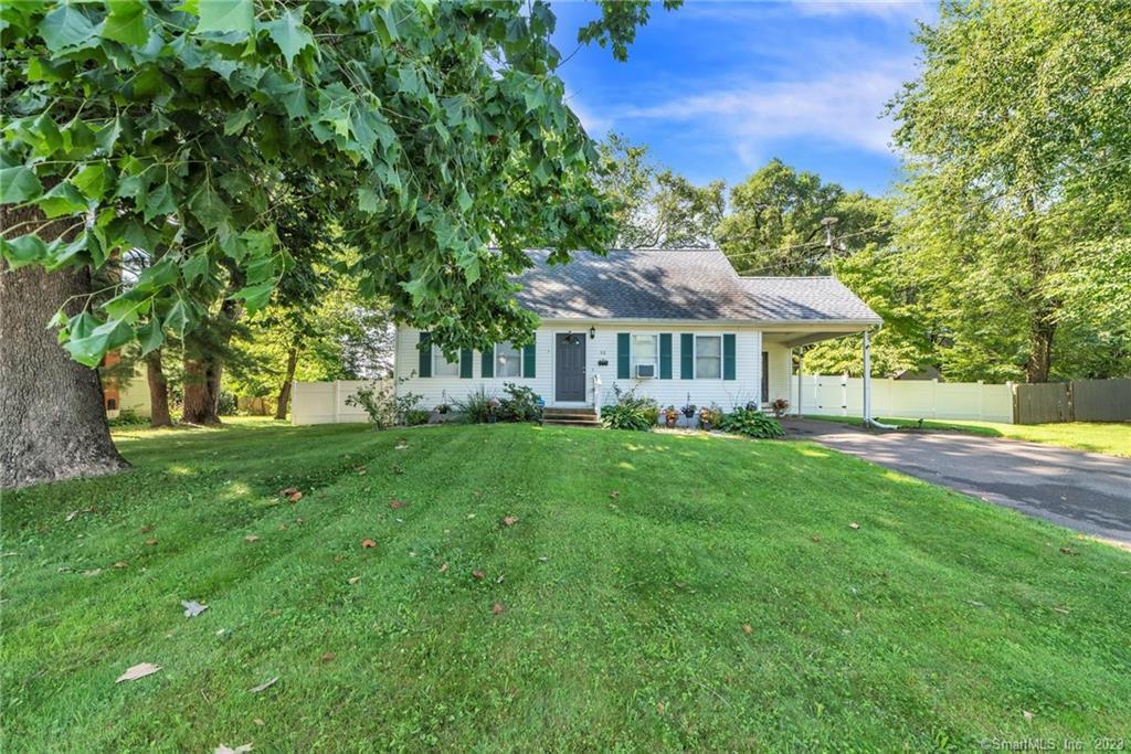 a view of a house with a yard