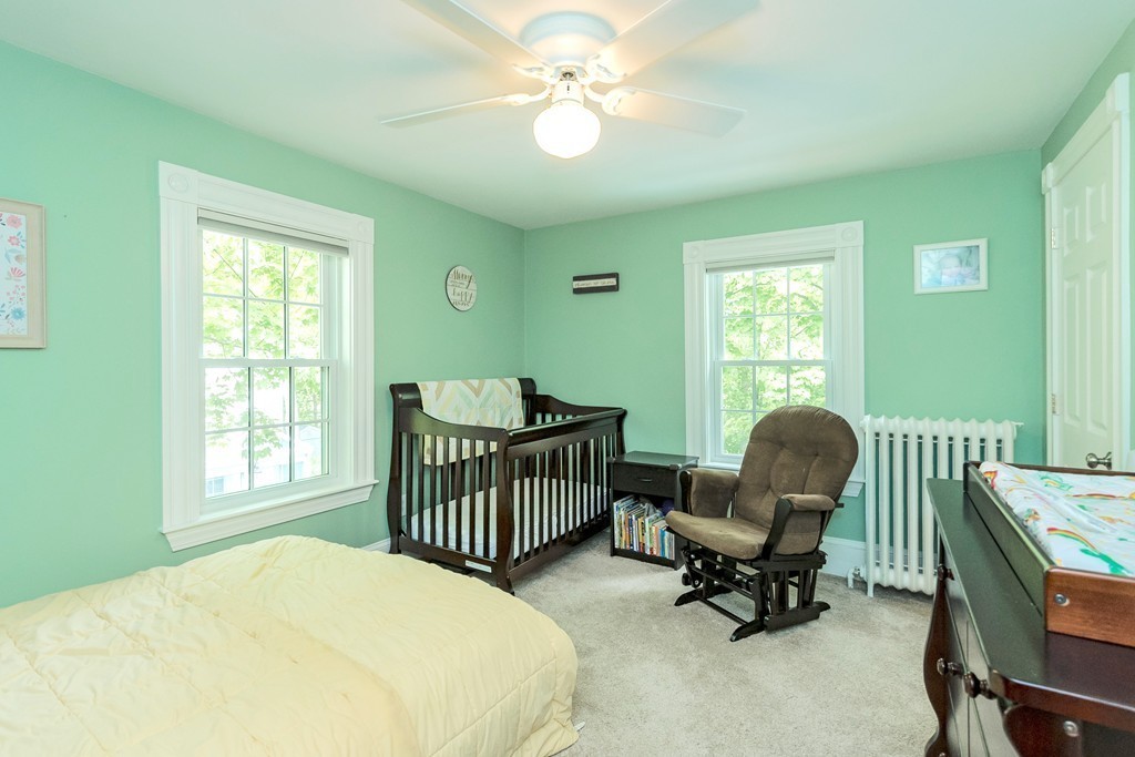 42 River Ridge Wellesley, MA 02481 - Photo 17 of 24 a bedroom with a bed and a chair