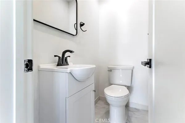 a bathroom with a toilet and a sink