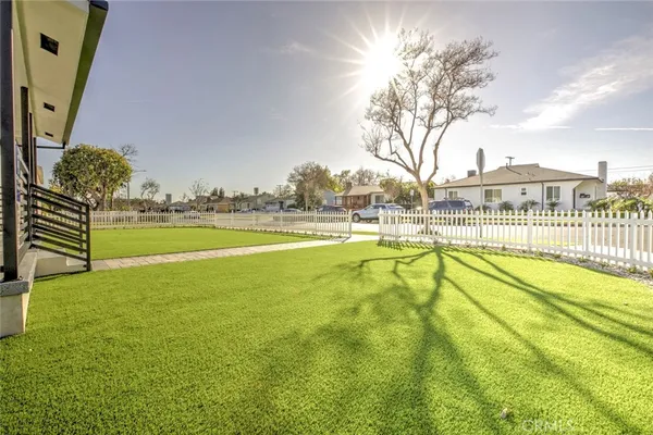 a view of a swimming pool with an outdoor seating and a yard