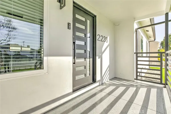 a view of a door and wooden floor