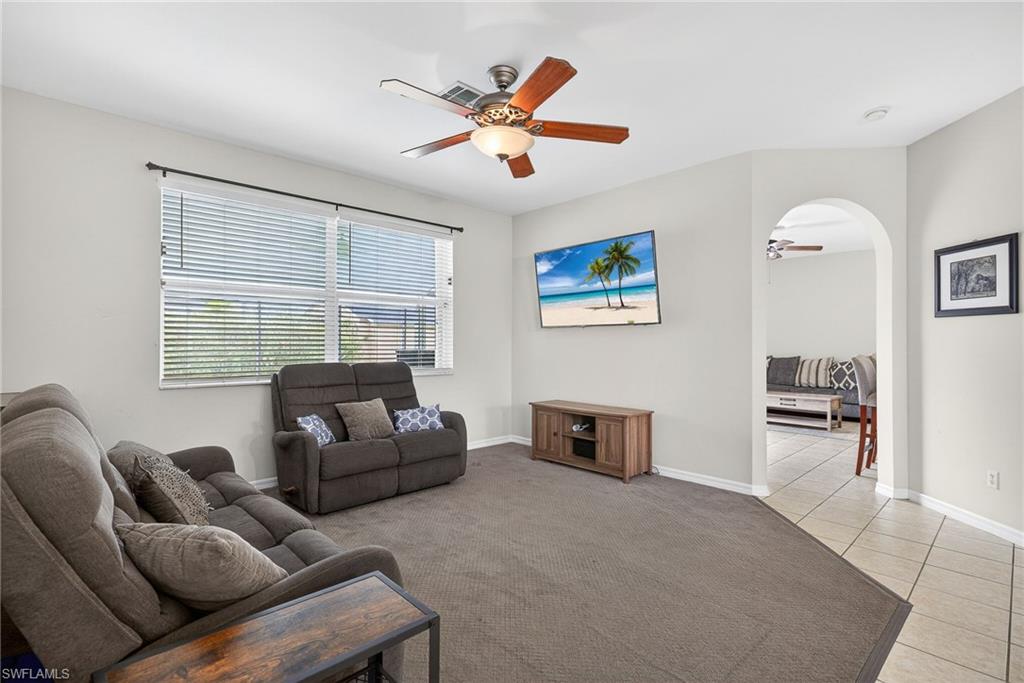 21560 Brixham Run Loop Estero, FL 33928 - Photo 13 of 43 Expansive sitting area and living room are perfect for friends and family to gather together.