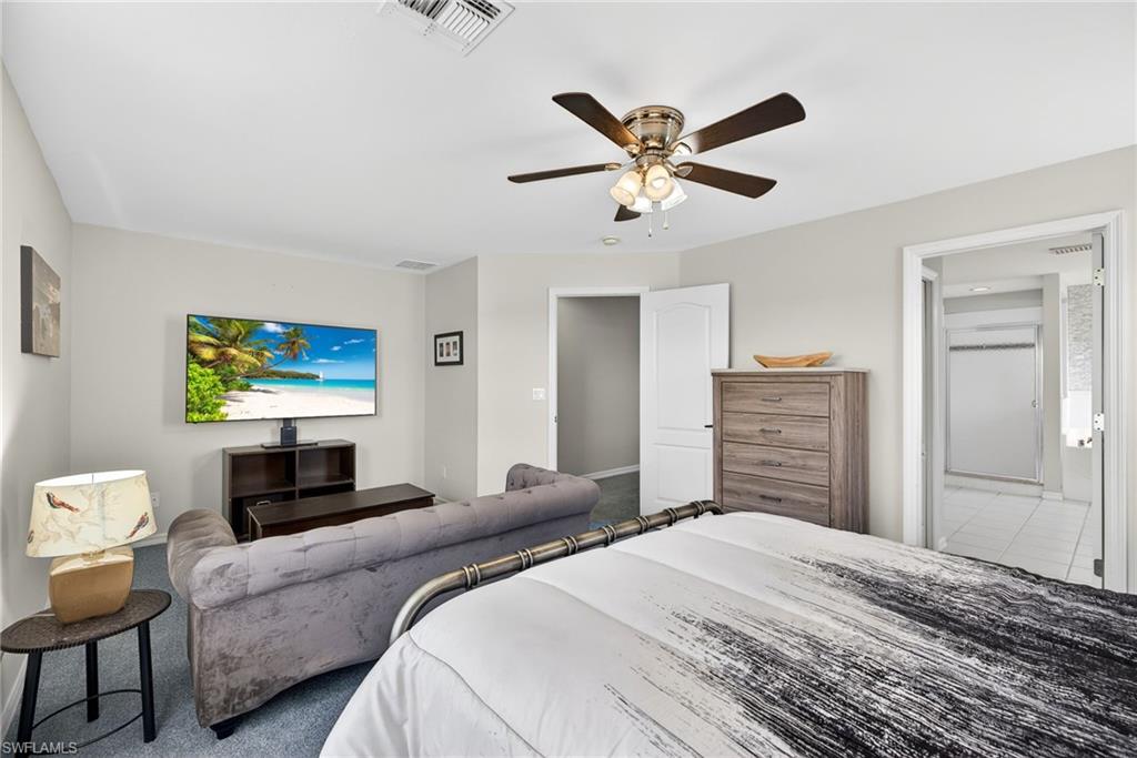 21560 Brixham Run Loop Estero, FL 33928 - Photo 19 of 43 Primary bedroom is designed for comfort, privacy, and relaxation.