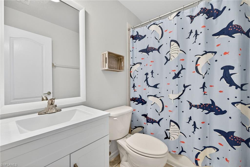 21560 Brixham Run Loop Estero, FL 33928 - Photo 25 of 43 Upstairs bathroom is complete with a full-shower/tub combo.