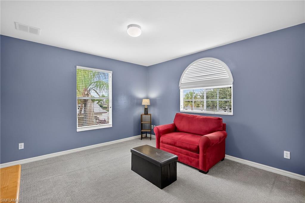 21560 Brixham Run Loop Estero, FL 33928 - Photo 26 of 43 Fourth bedroom is filled with natural light, creating a bright and inviting space.