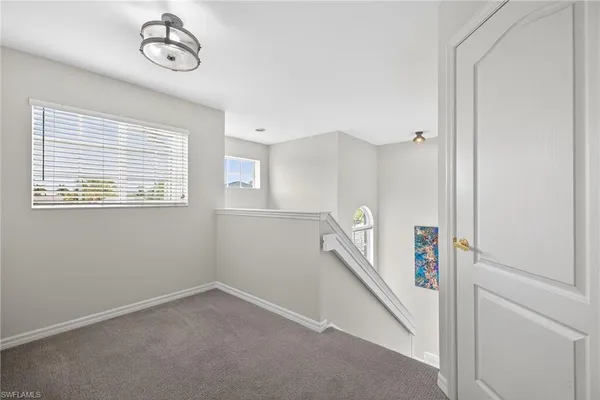 a workspace with furniture and a window