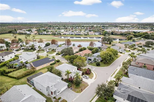 an aerial view of residential houses with outdoor space