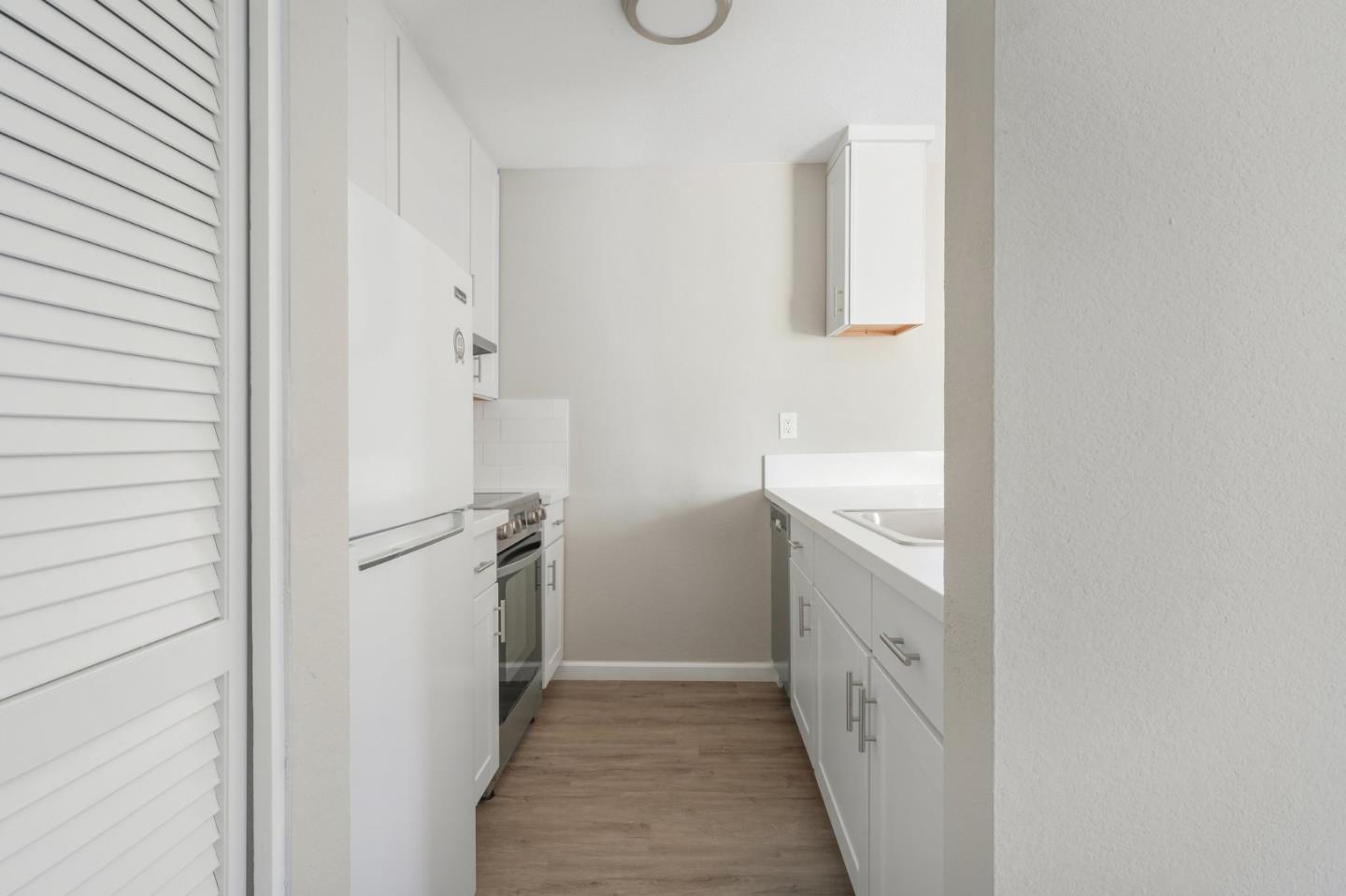 288 Stonegate Circle San Jose, CA 95110 - Photo 12 of 18 a bathroom with a sink and a mirror
