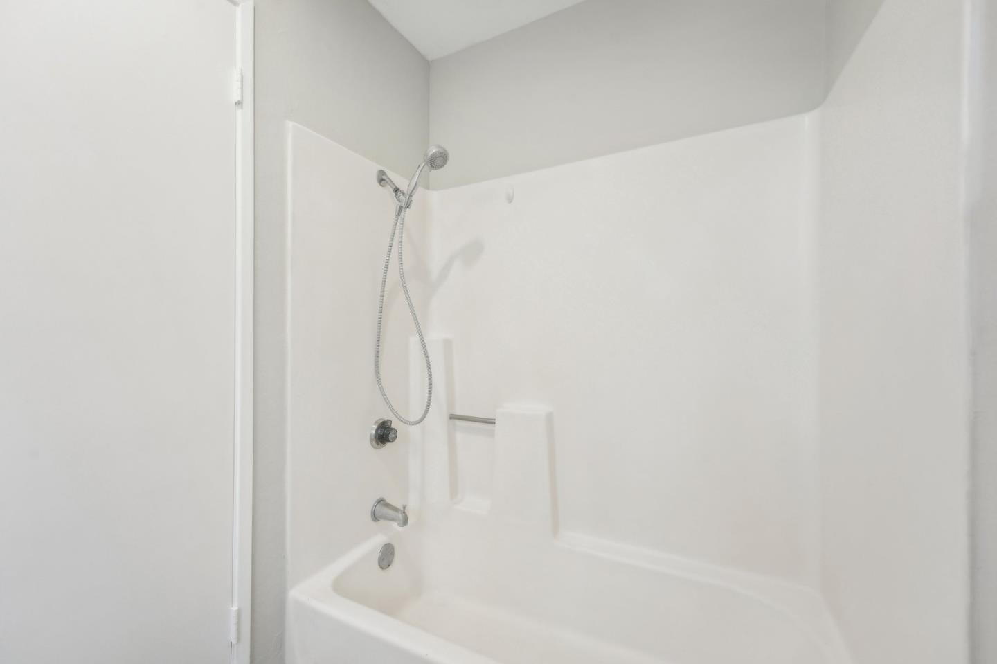 288 Stonegate Circle San Jose, CA 95110 - Photo 15 of 18 a white bath tub with a shower
