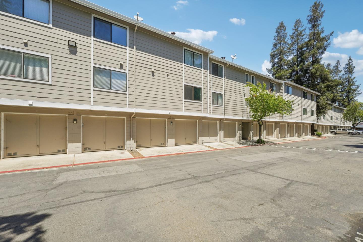 288 Stonegate Circle San Jose, CA 95110 - Photo 16 of 18 a view of a house with a backyard and a garage