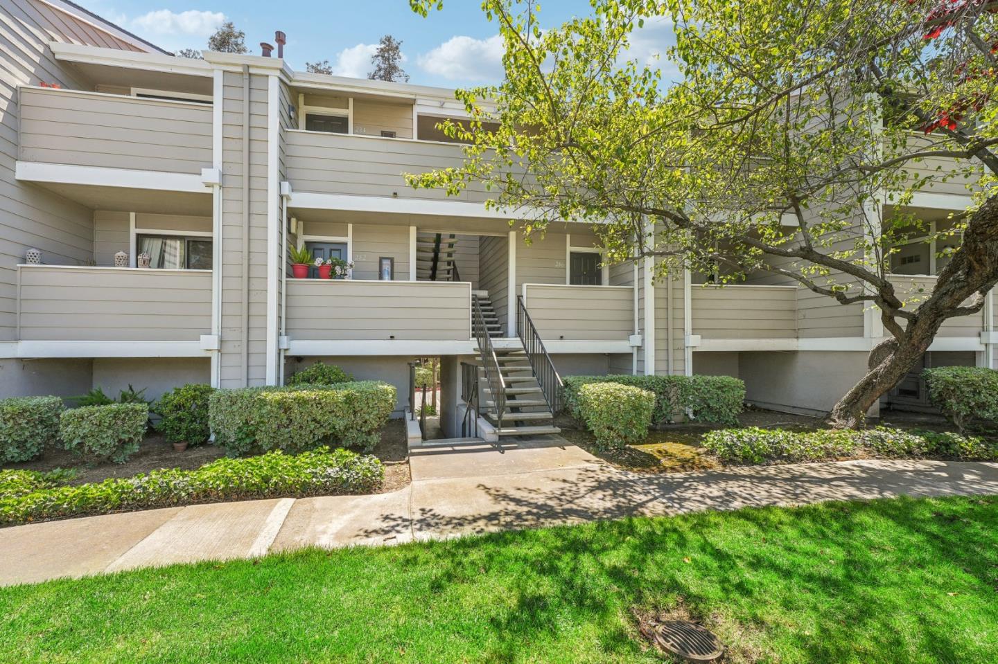 288 Stonegate Circle San Jose, CA 95110 - Photo 3 of 18 a front view of a house with garden