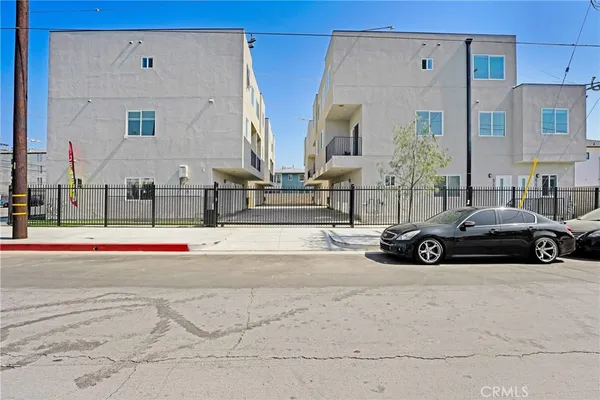 a view of a car parked in front of a building