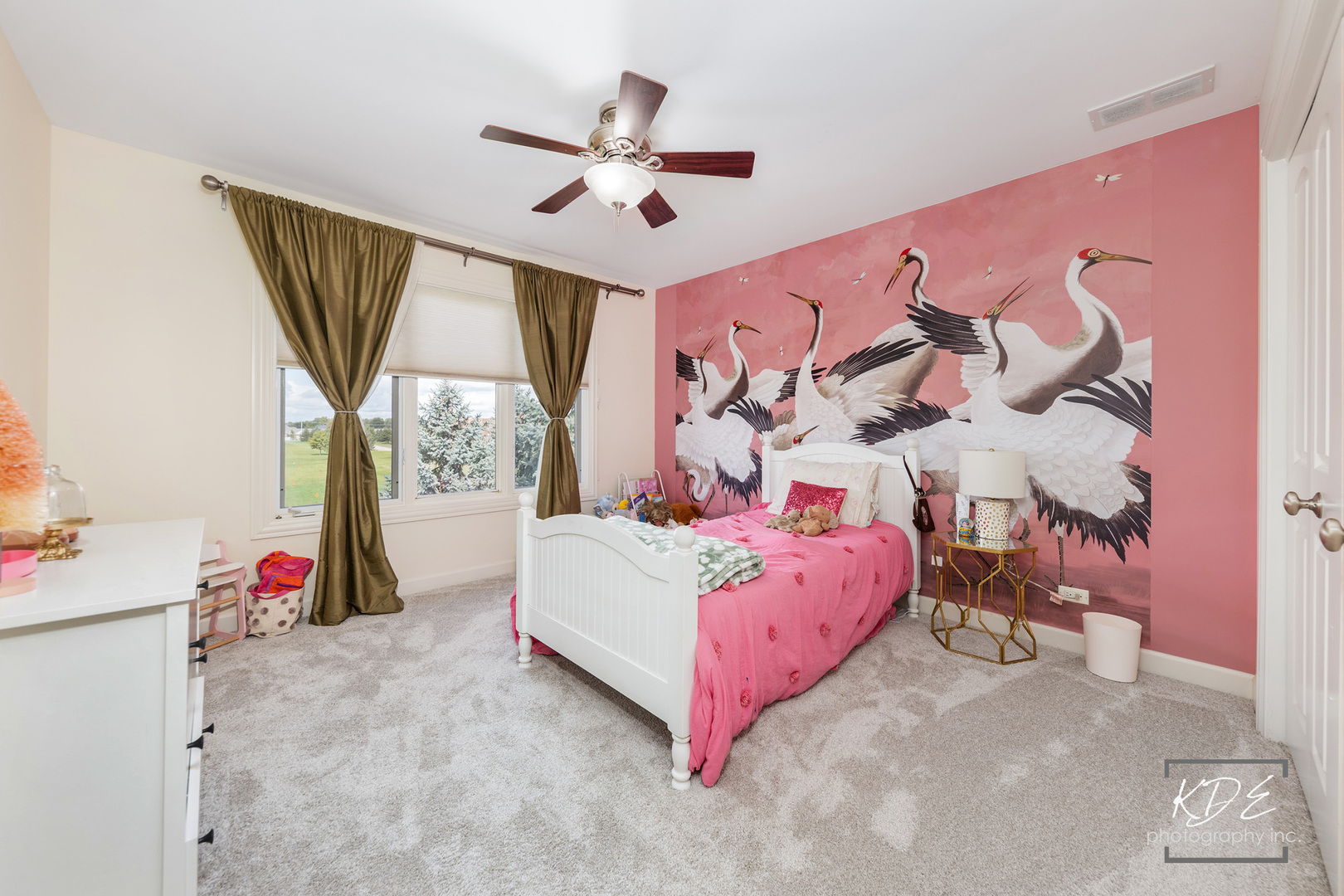 4043 Juneberry Road Naperville, IL 60564 - Photo 27 of 53 a bedroom with a bed and a chandelier
