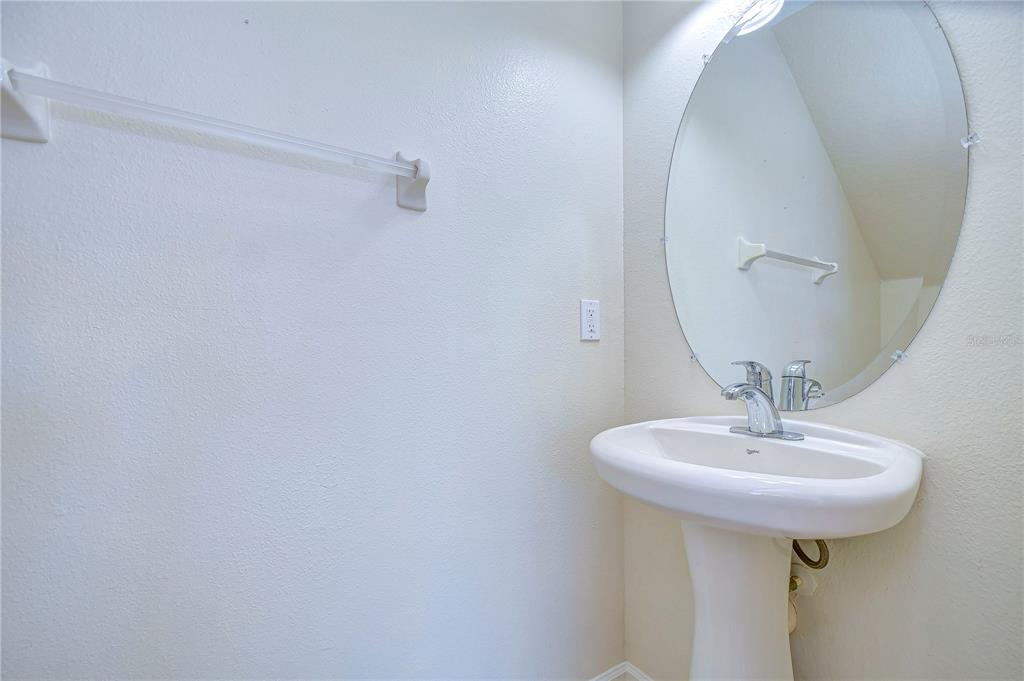 4744 Pond Ridge Drive Riverview, FL 33578 - Photo 13 of 18 a bathroom with a sink a mirror and vanity