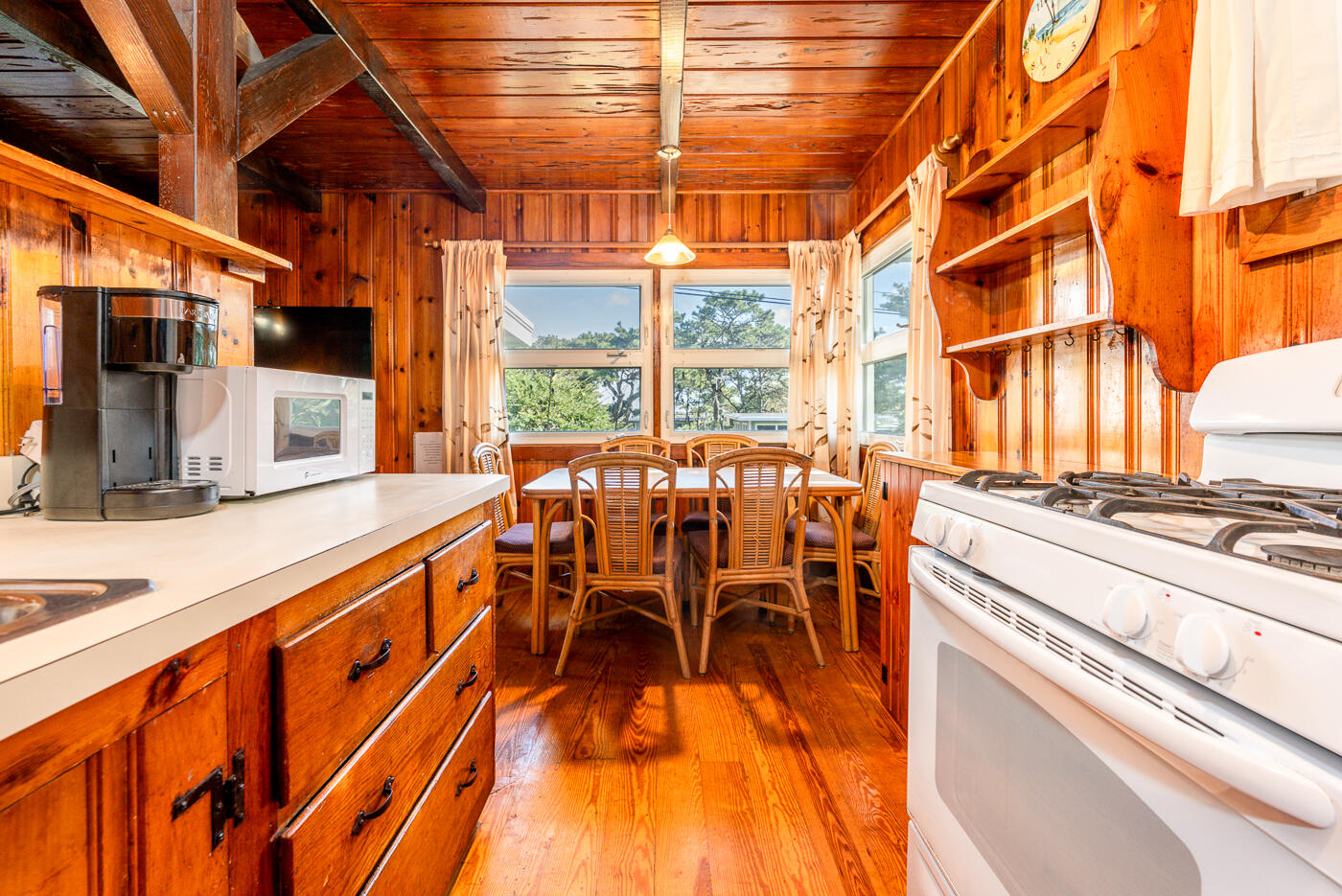 45 Ocean View Drive, Unit 7 Wellfleet, MA 02667 - Photo 11 of 32 a dining room with furniture and a large window