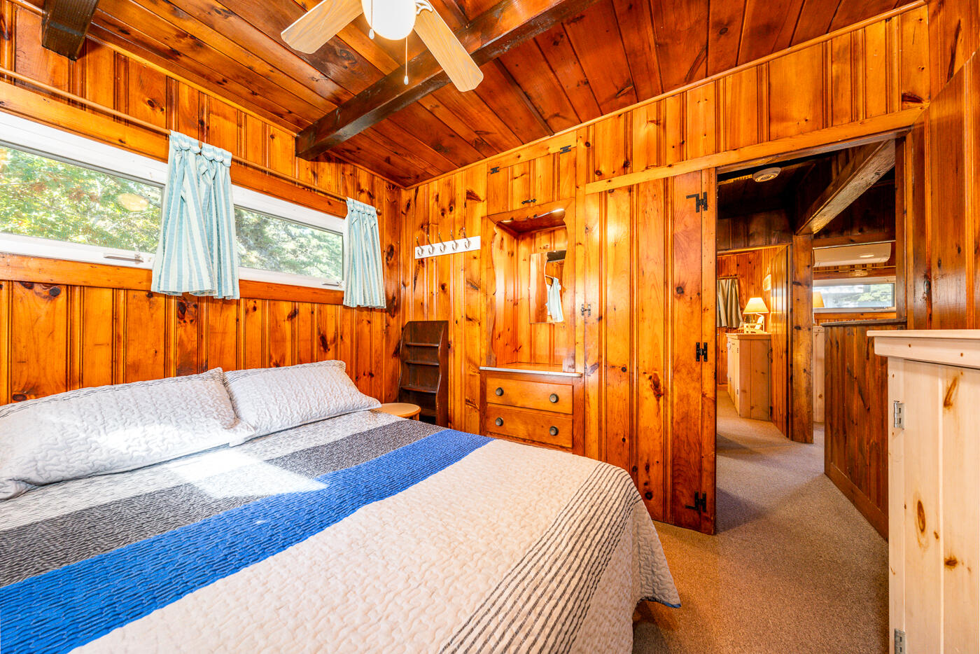 45 Ocean View Drive, Unit 7 Wellfleet, MA 02667 - Photo 14 of 32 a bedroom with a bed and a couch