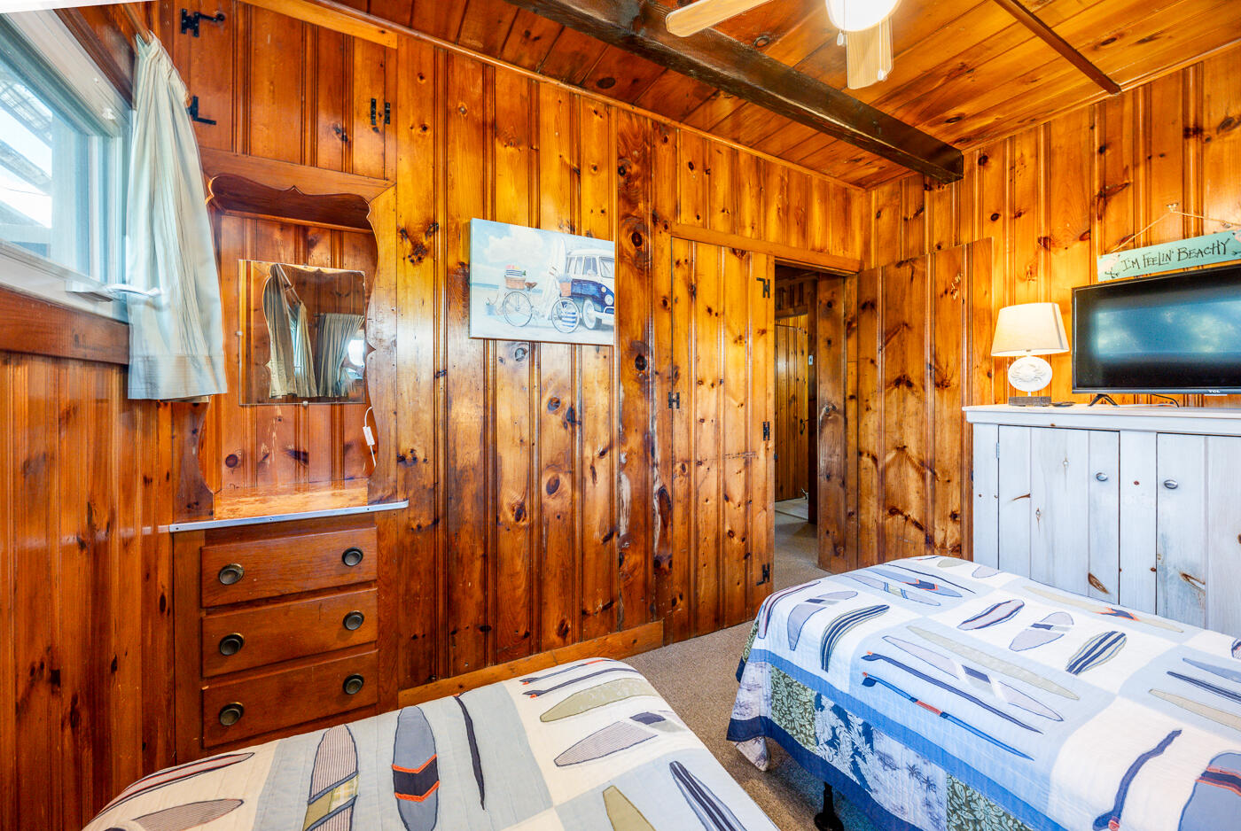 45 Ocean View Drive, Unit 7 Wellfleet, MA 02667 - Photo 16 of 32 a bedroom with a bed and a flat tv screen on dresser