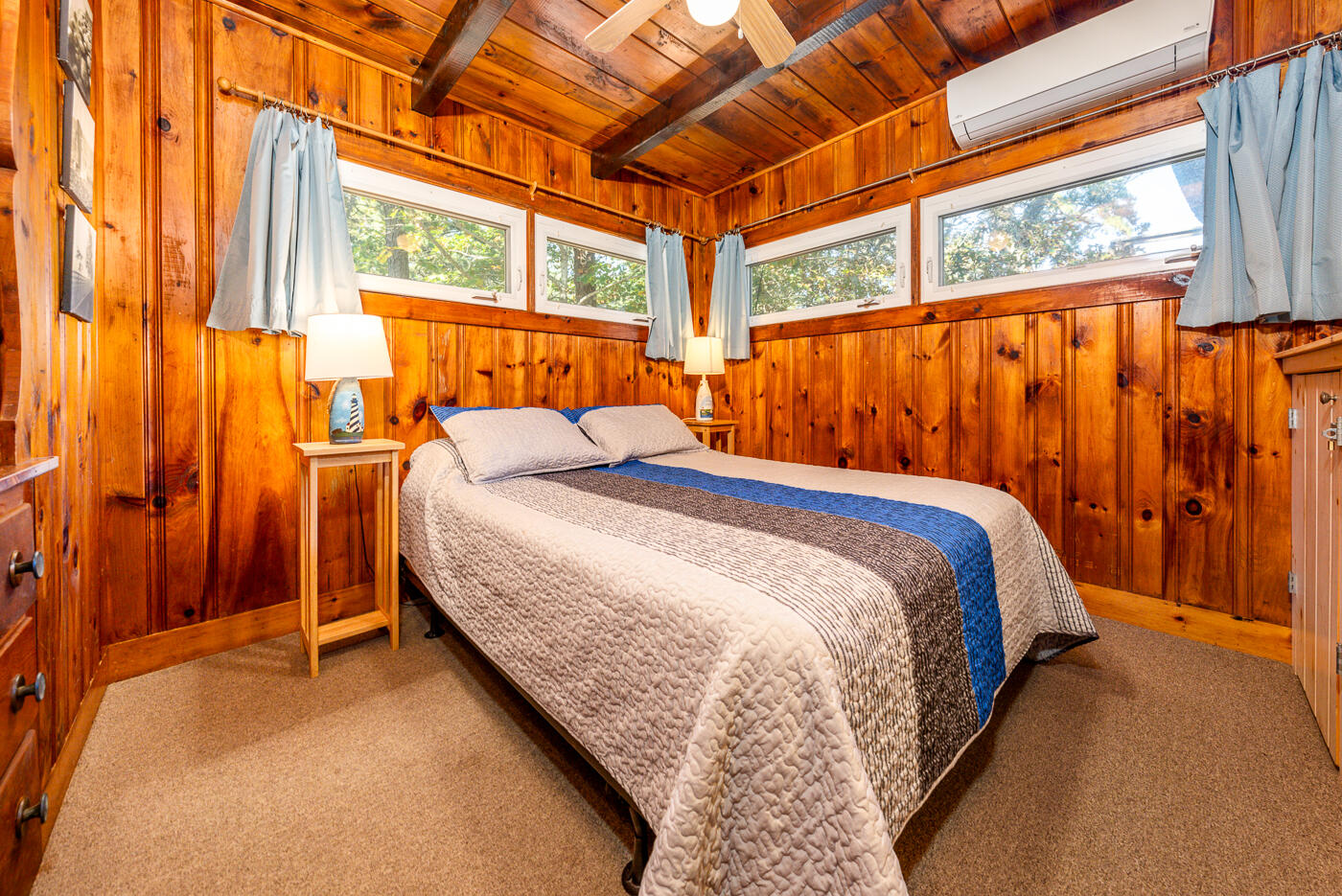 45 Ocean View Drive, Unit 7 Wellfleet, MA 02667 - Photo 17 of 32 a bed sitting in a bedroom next to a window