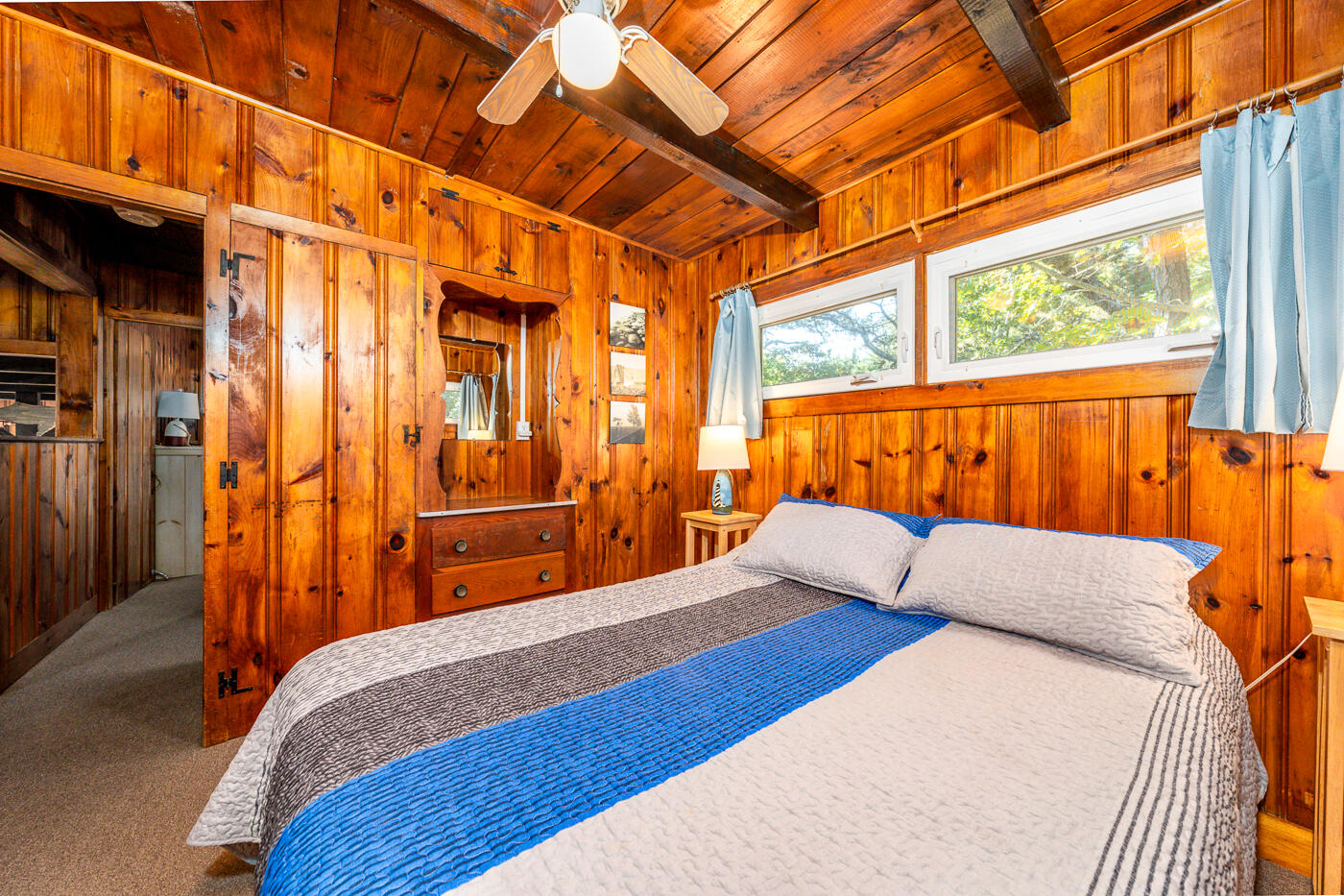 45 Ocean View Drive, Unit 7 Wellfleet, MA 02667 - Photo 18 of 32 a bedroom with natural light and a bed