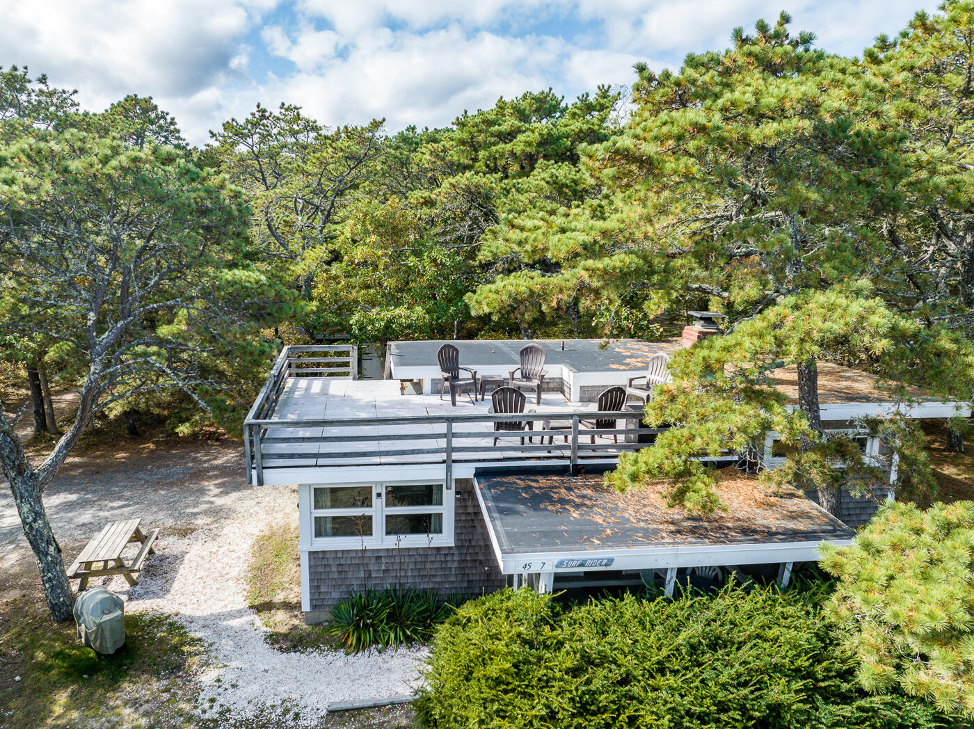 45 Ocean View Drive, Unit 7 Wellfleet, MA 02667 - Photo 25 of 32 a front view of a house with a garden