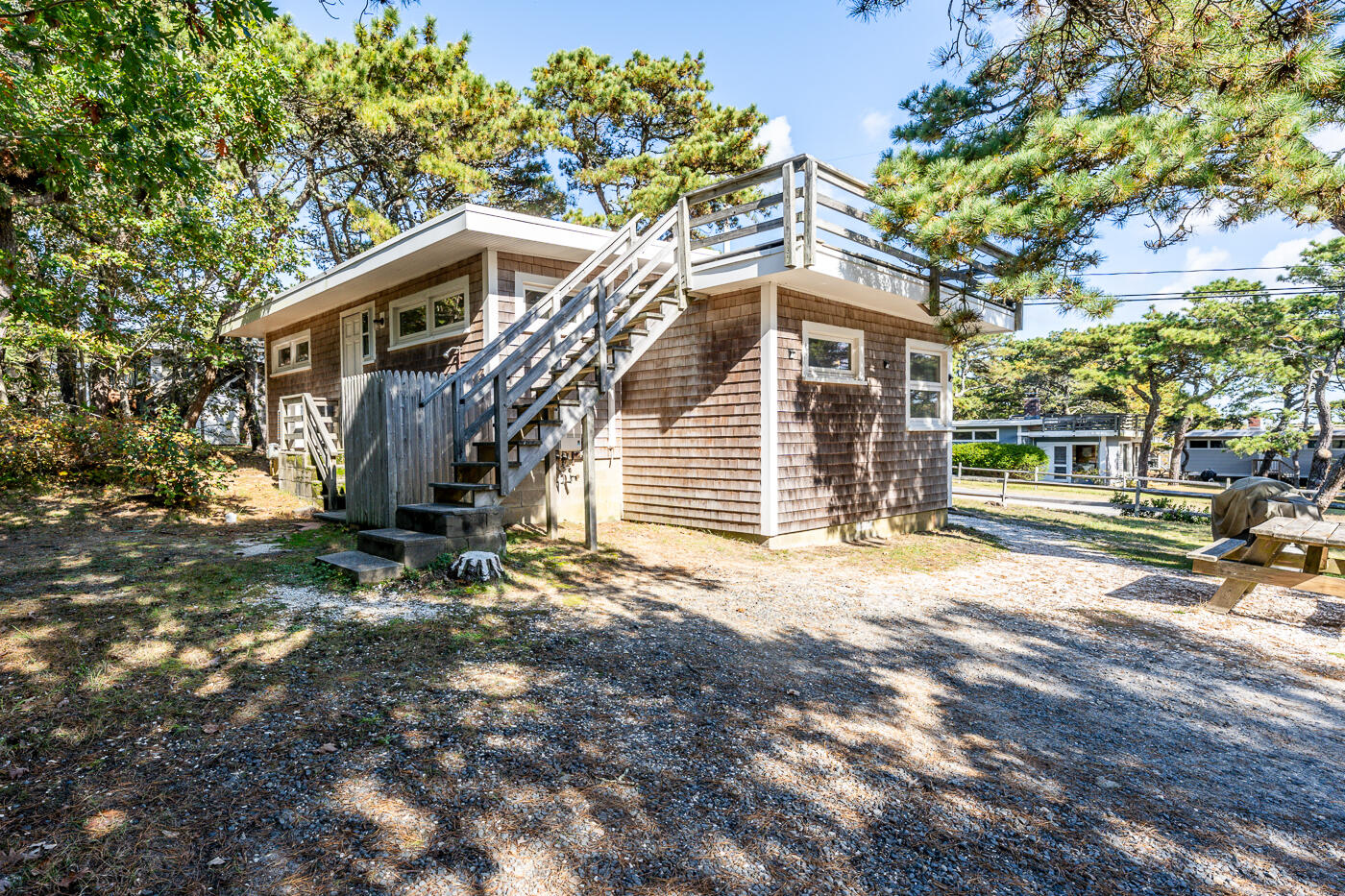 45 Ocean View Drive, Unit 7 Wellfleet, MA 02667 - Photo 26 of 32 a front view of a house with a yard
