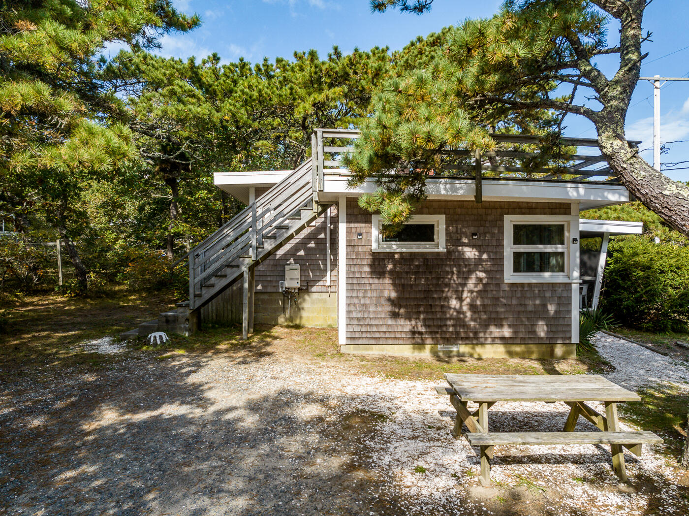 45 Ocean View Drive, Unit 7 Wellfleet, MA 02667 - Photo 27 of 32 front view of a house with a tree