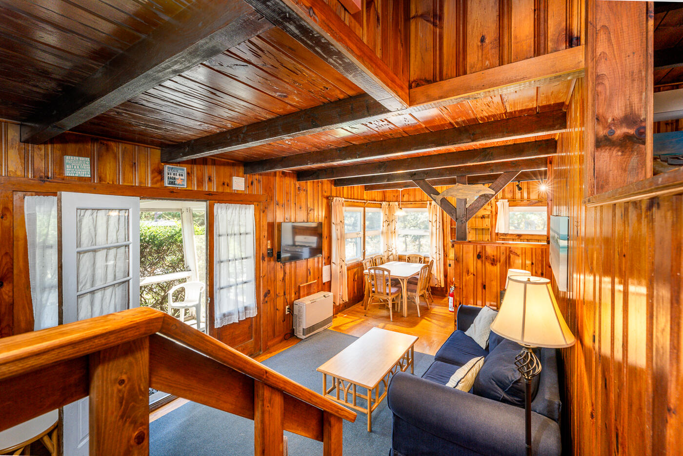 45 Ocean View Drive, Unit 7 Wellfleet, MA 02667 - Photo 5 of 32 a living room with furniture and a large window