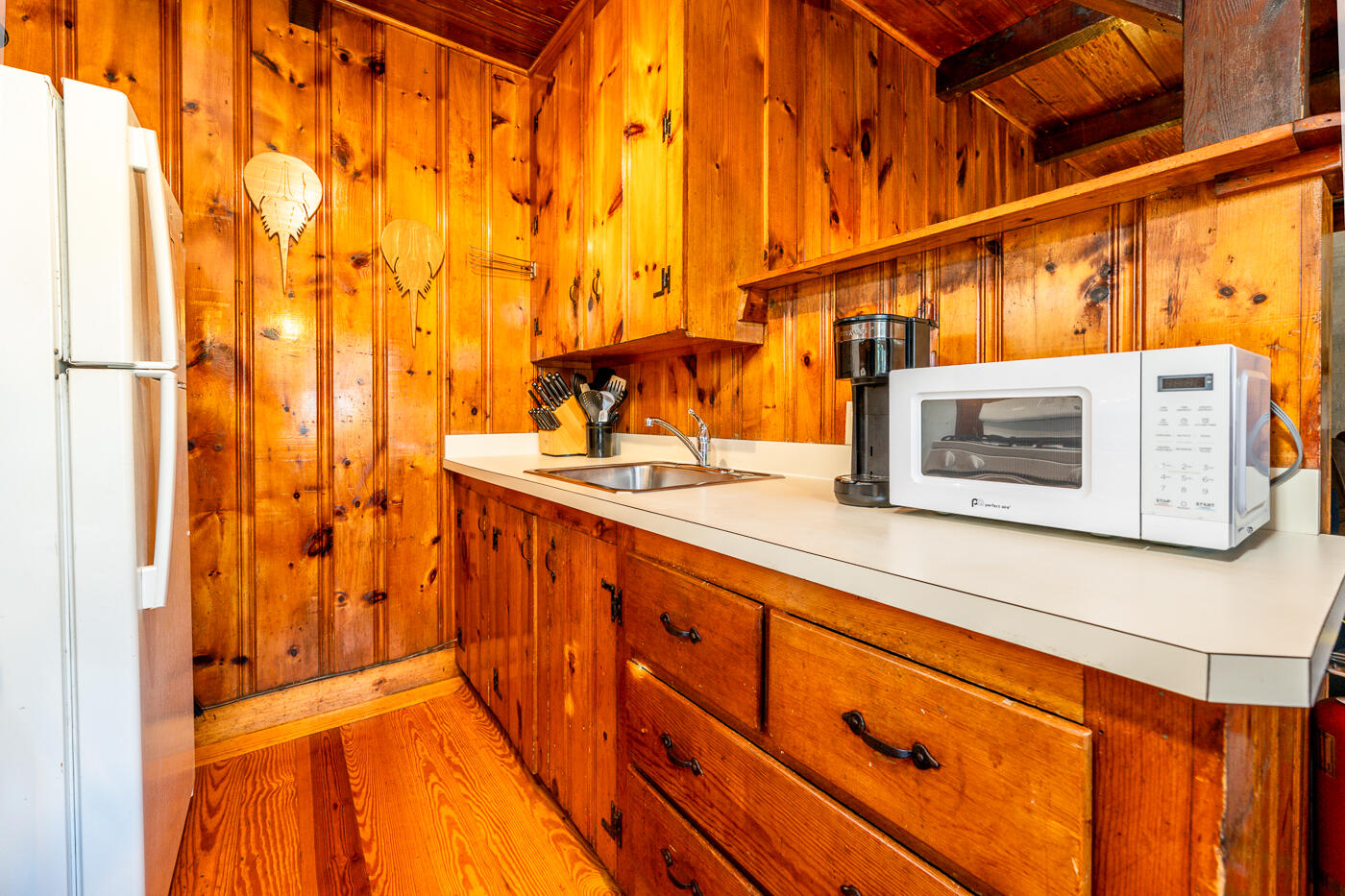 45 Ocean View Drive, Unit 7 Wellfleet, MA 02667 - Photo 10 of 32 a bathroom with a sink and a mirror