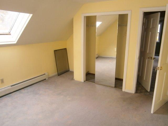 589 Skunknet Road Centerville, MA 02632 - Photo 13 of 15 an empty room with closet and a window