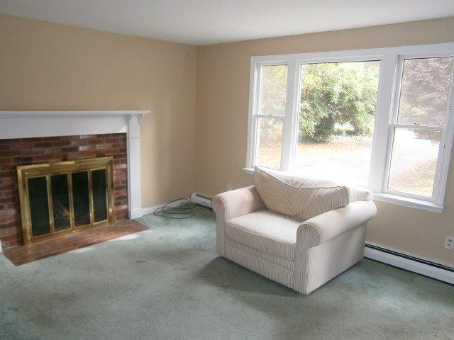 589 Skunknet Road Centerville, MA 02632 - Photo 2 of 15 a living room with furniture and a large window