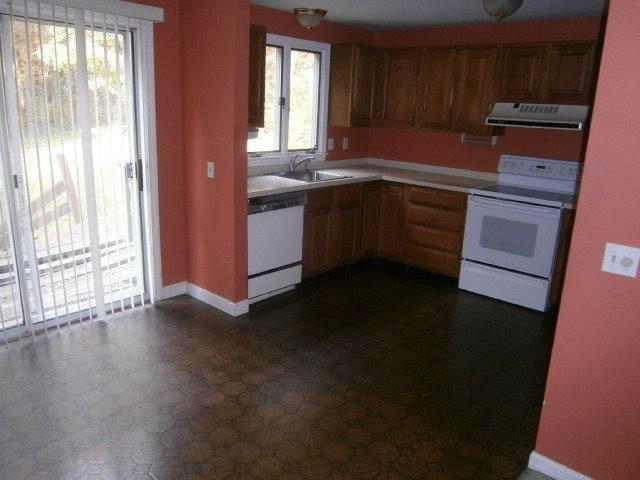 589 Skunknet Road Centerville, MA 02632 - Photo 5 of 15 a kitchen with a sink a window and appliances