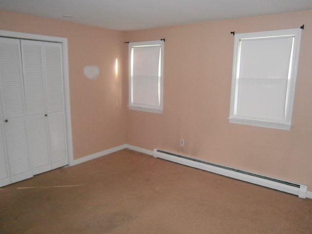589 Skunknet Road Centerville, MA 02632 - Photo 8 of 15 an empty room with windows