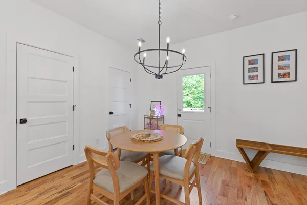 a view of a dining room with furniture window and wooden floor