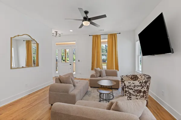 a living room with furniture and a flat screen tv