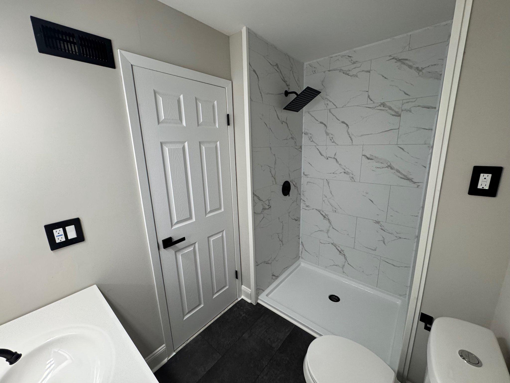 8 Framingham Road Beverly, NJ 08010 - Photo 18 of 35 a bathroom with a shower toilet and sink