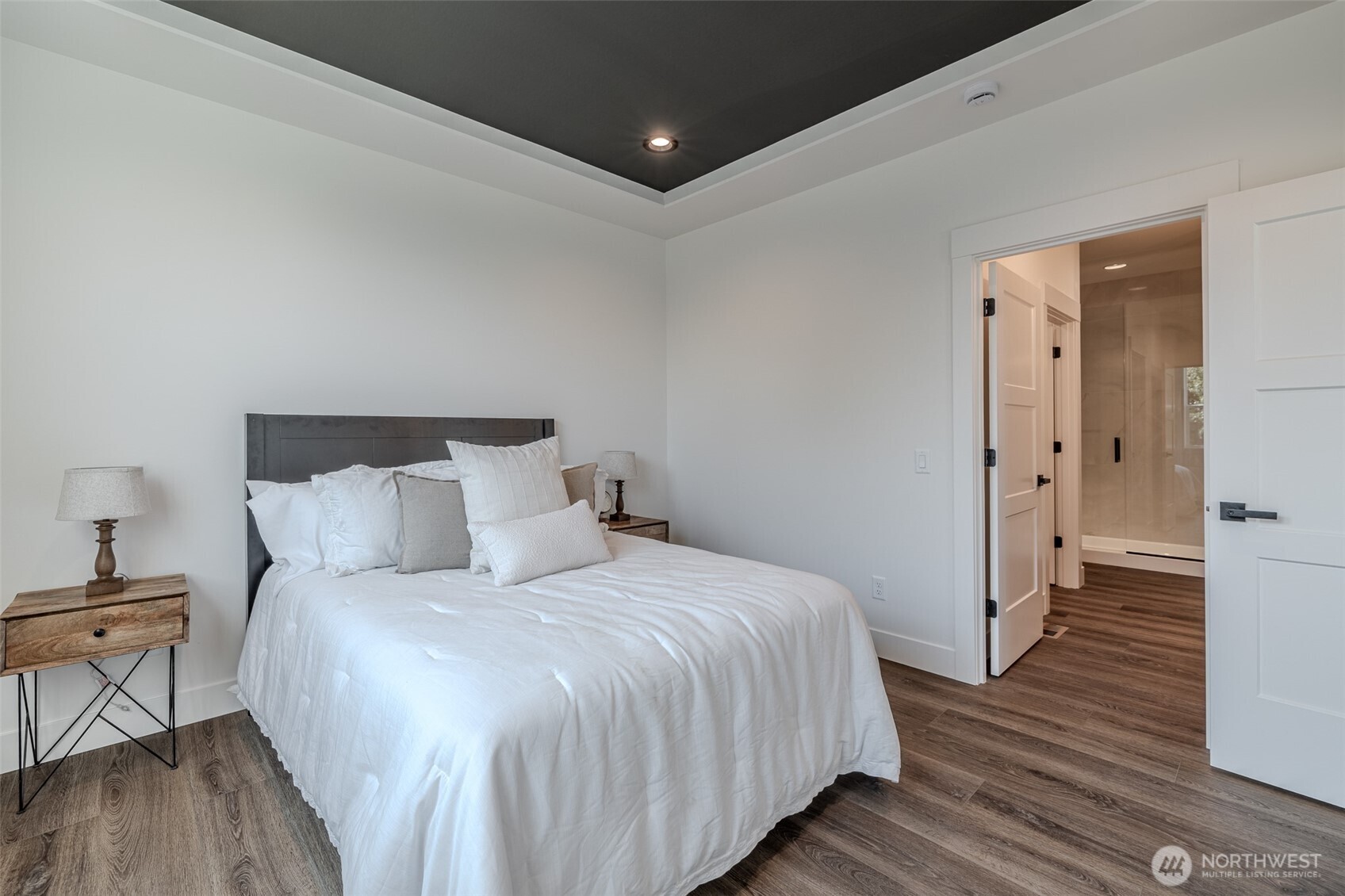 960 Wayne Lane Wenatchee, WA 98801 - Photo 10 of 22 a bedroom with a bed and wooden floor