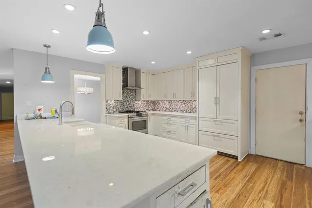 a large kitchen with cabinets