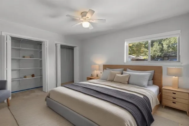 a bathroom with a granite countertop sink mirror toilet and bathtub