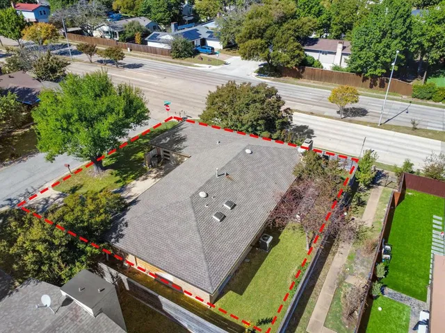 a view of a porch with furniture and a yard