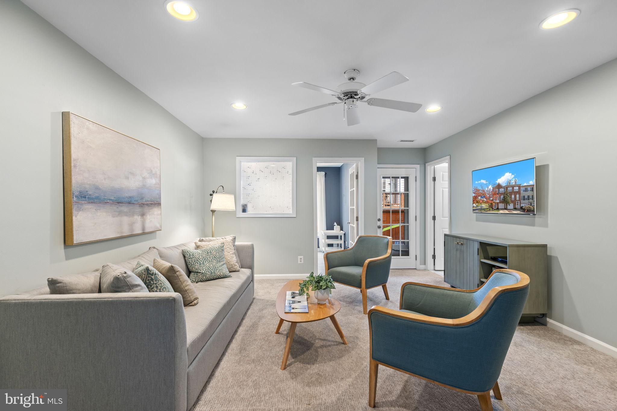 6311 Burgundy Leaf Lane Alexandria, VA 22312 - Photo 16 of 33 a living room with furniture and a ceiling fan
