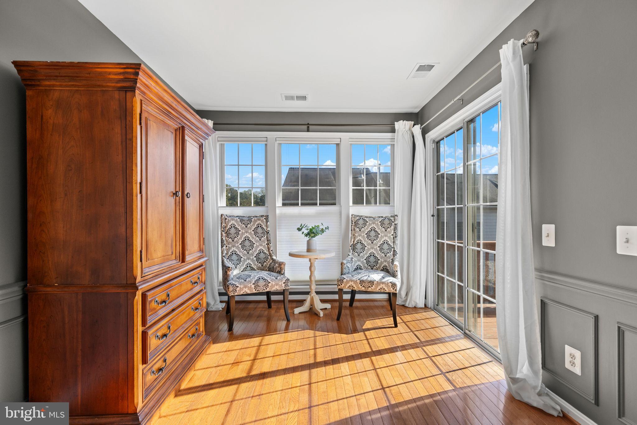 6311 Burgundy Leaf Lane Alexandria, VA 22312 - Photo 23 of 33 a living room with a large window and furniture